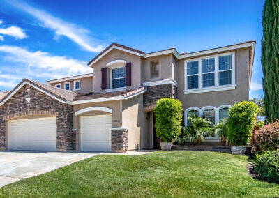 Front of house with green lawn and shrubs, tyler media works, real estate photography