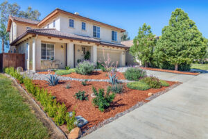 16 Front of home with red bark and succulent landscaping