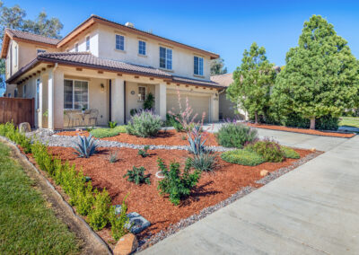 Front of home with red bark and succulent landscaping, tyler media works, real estate photography