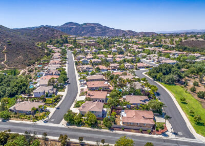 Aerial view of community with mountains in background, tyler media works, real estate photography