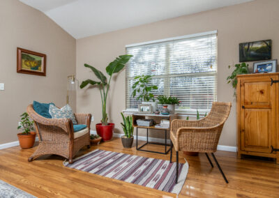 Living area with wood panel flooring, tyler media works, real estate photography