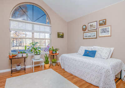 Bedroom with wood panel flooring, tyler media works, real estate photography
