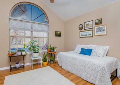 Bedroom with wood panel flooring, tyler media works, real estate photography