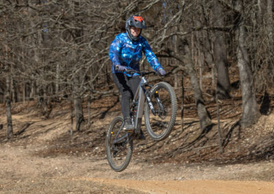 mountain biker going over a jump