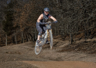 mountain biker going over a jump