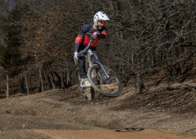 mountain biker going over a jump
