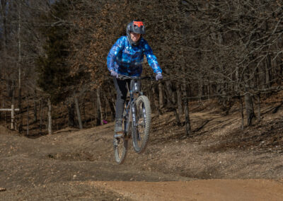 mountain biker going over a jump