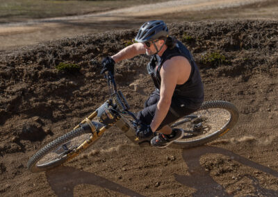 mountain biker going over around a berm