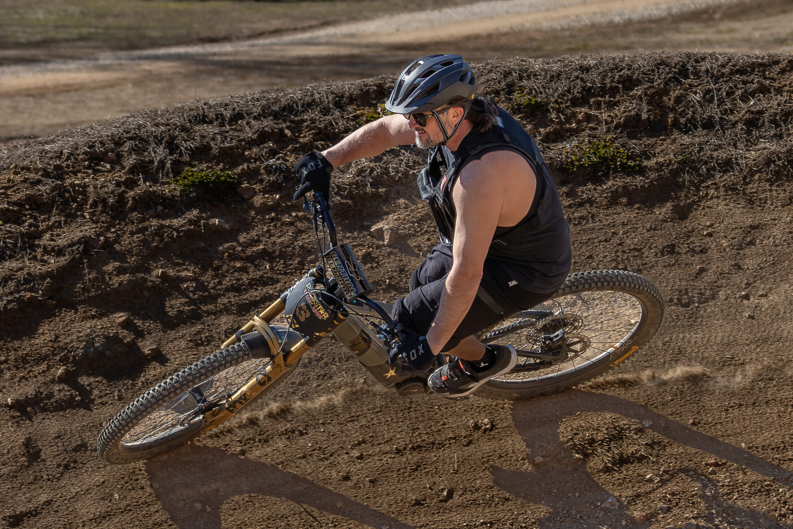 18 mountain biker going over around a berm