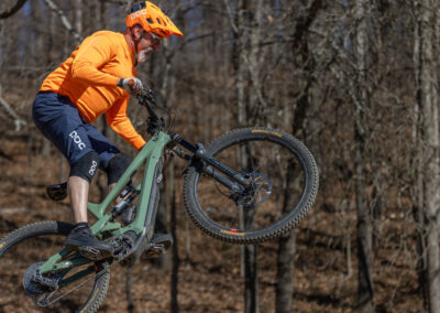 mountain biker going over a jump