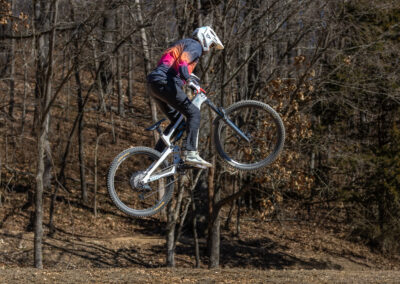 mountain biker going over a jump