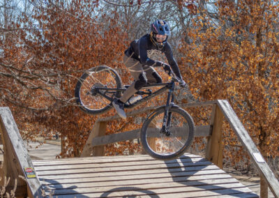 mountain biker going over a jump
