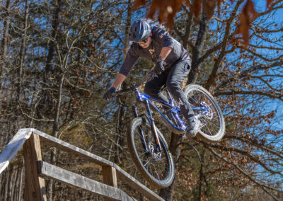 mountain biker going over a jump